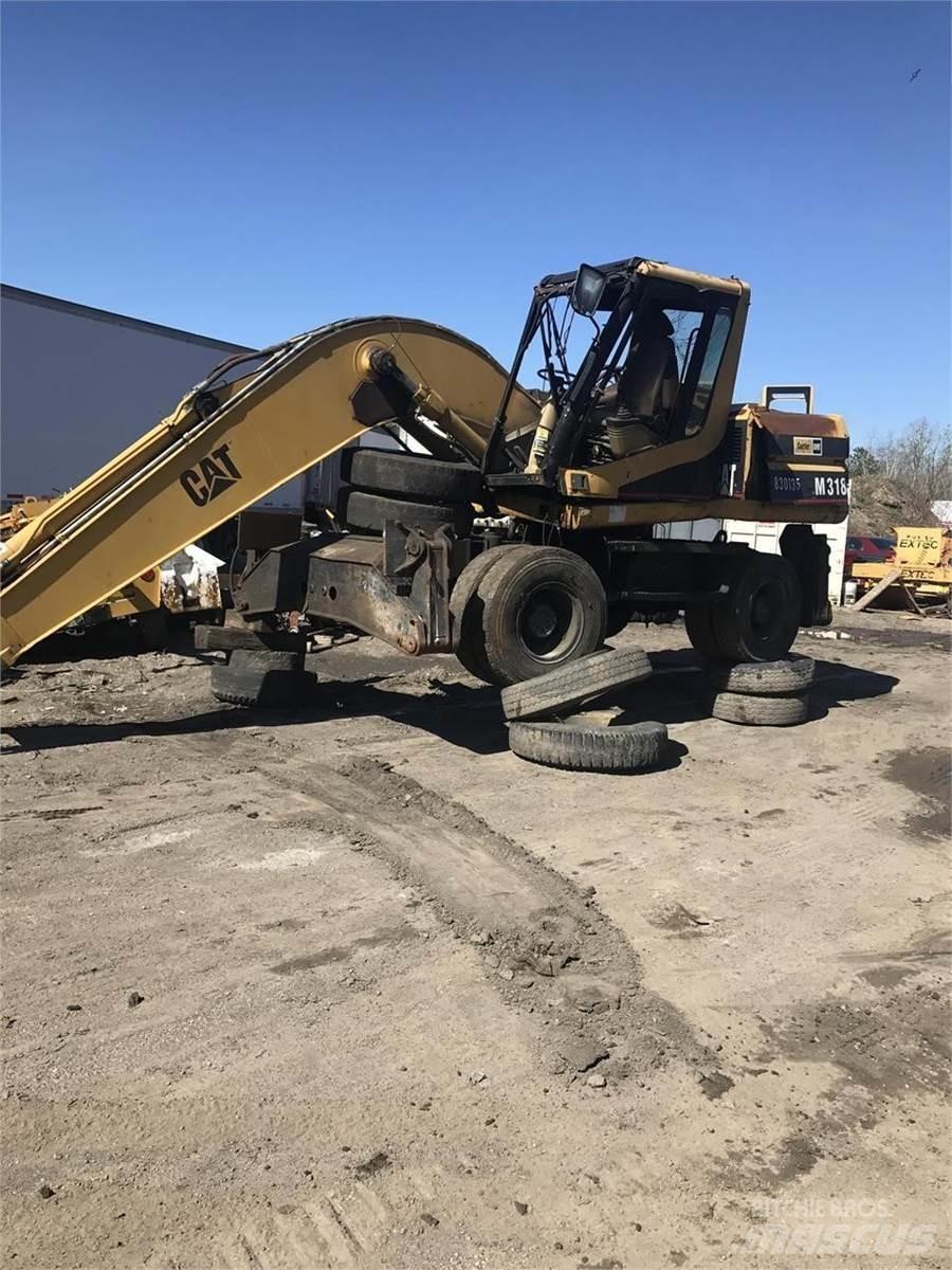 CAT M318 Wielgraafmachines