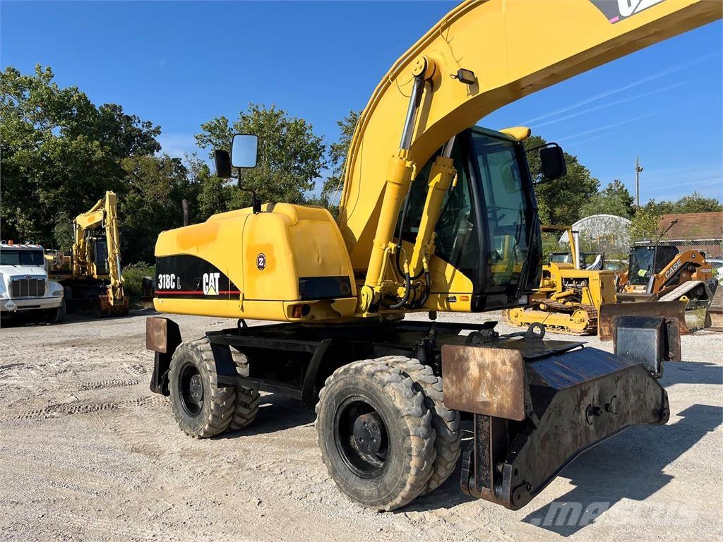 CAT M318C Wielgraafmachines