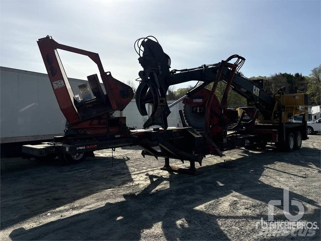 CAT 559 Boomstamladers